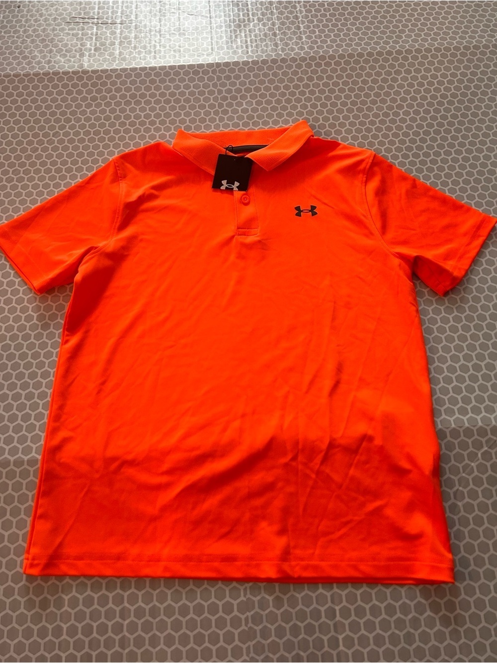 NWT Under Amour Youth Bright Orange Polo Shirt. Size YL